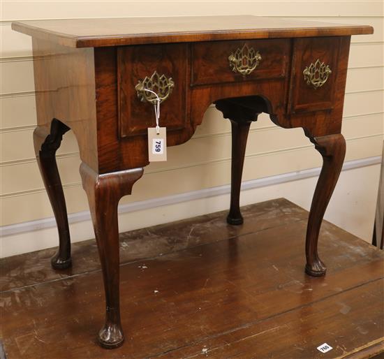 An early 18th century crossbanded walnut lowboy (restored) W.77cm